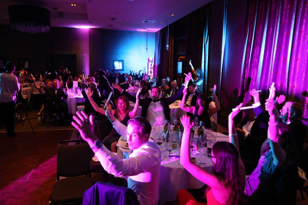 Crowd enjoying themselves with glowsticks